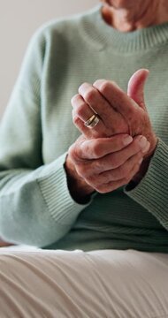 Arthritis, hands or old woman in house with massage, joint pain or stiffness in finger movement. Retirement, ache or elderly person in home with rub, inflammation and muscle stretching for tendinitis