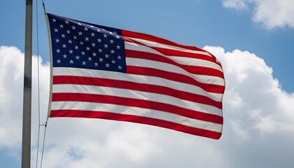 Obraz premium Tall American Flag Wagging in Wind at Bright Sky