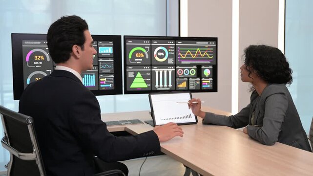 Diverse business team professional data analysts working together in office using tablet digital dashboard for financial marketing growth research. Expert colleagues analyzing corporate infographic ch