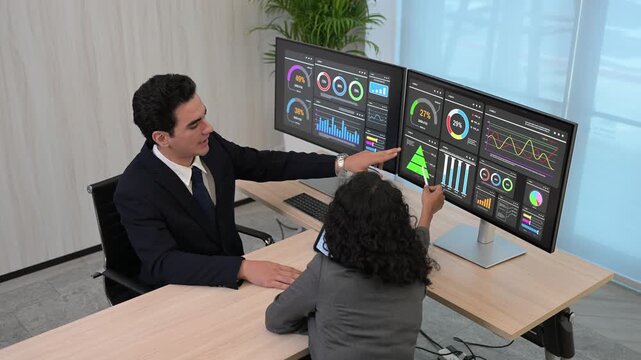 Diverse business team professional data analysts working together in office using tablet digital dashboard for financial marketing growth research. Expert colleagues analyzing corporate infographic ch