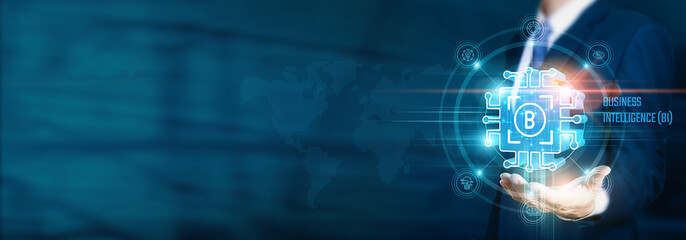 Obraz premium Businessman hand-holding business intelligence (BI) icons with analytics, data visualization, and network connections. Strategically leveraging insights for informed decision-making.