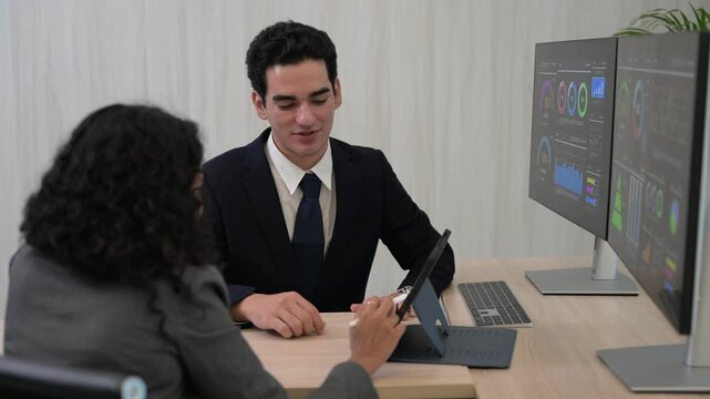 Diverse business team professional data analysts working together in office using tablet digital dashboard for financial marketing growth research. Expert colleagues analyzing corporate infographic ch