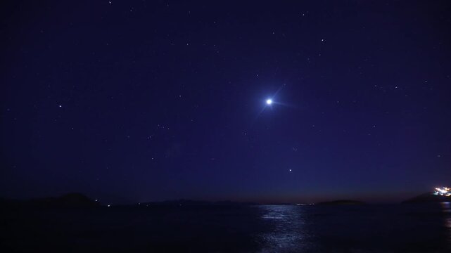 Beautiful Timelapse of New Moon Setting over Aegean Coastal Islands and Glittering Stars in Evening