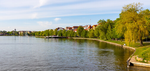 Panoramic view of Elk town with historic city center and waterfront promenade at Jezioro Elckie Lake in Mazuria lakeland region of Poland © Art Media Factory