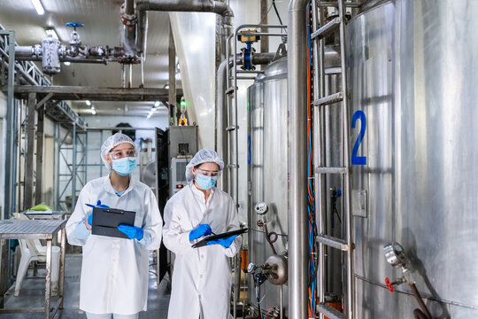:[img]https://i.imgur.com/4jRQZ9l.jpg[/img]. Quality control and hygiene standards in modern canned fish processing factory, concept of food safety and industrial manufacturing.