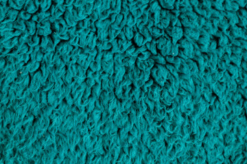 Turquoise long pile fluffy fabric texture macro soft fleece background © Iryna Miadzvedzeva
