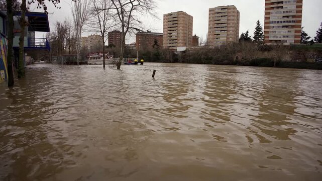 Water level of the overflowing pisuerga river receding in valladolid
