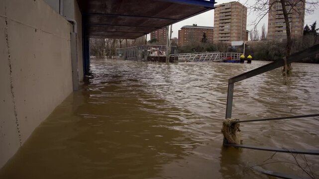 Water level of the overflowing pisuerga river receding in valladolid