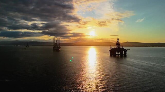 sunset at oil rig graveyard of cromarty