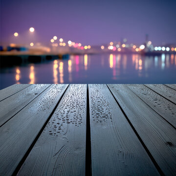 Empty wooden pier at night with city lights reflecting on calm water, tranquil atmosphere, wet surface, urban waterfront, serene mood