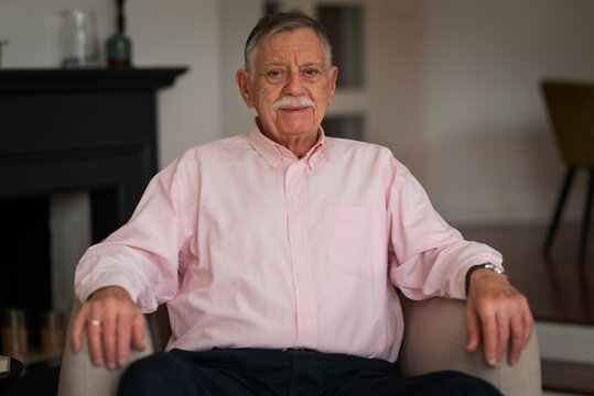 Portrait of a senior man relaxing in an armchair at home