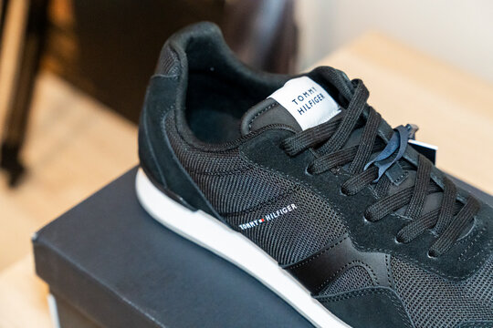 Warsaw, Poland - April 20, 2026: Close-up of a stylish black sneaker by Tommy Hilfiger showcasing modern design. Perfect for casual wear or fitness activities.