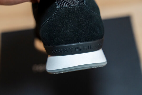 Warsaw, Poland - April 20, 2026: Close-up of a black sneaker with Tommy Hilfiger branding, showcasing stylish design and premium materials. Ideal for fashion and footwear marketing.