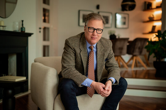Portrait of a mature man sitting at home