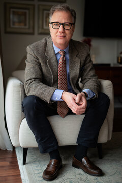 Portrait of a mature man sitting at home