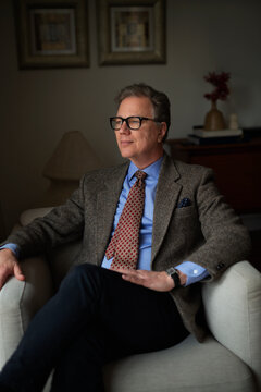 Portrait of a mature man sitting at home