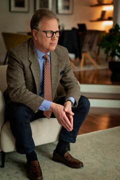 Portrait of a mature man sitting at home