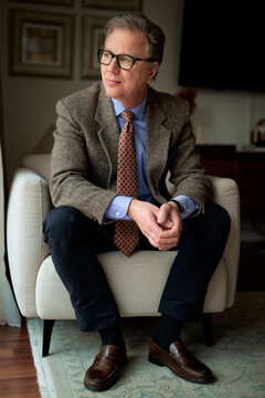 Portrait of a mature man sitting at home