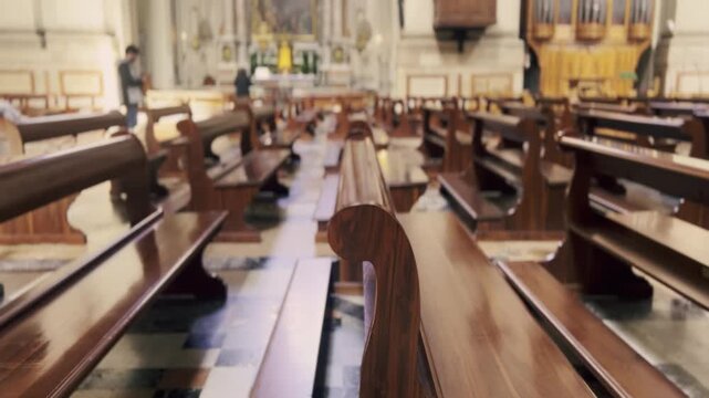 Majestic view of a quiet christian church interior with rows of empty polished wooden pews leading to the altar, a perfect representation of faith, solitude, and religious contemplation