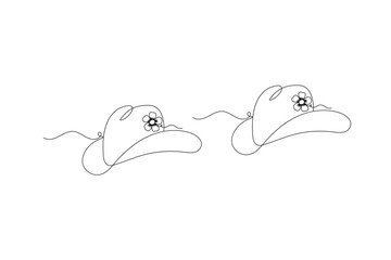 Obraz premium Cowboy hat with continuous one-line art drawing on a white background for a western-themed design 