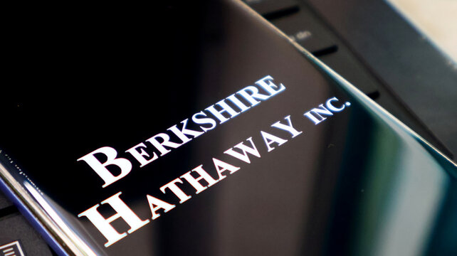 A close-up view of a Berkshire Hathaway Inc. logo on a black screen
