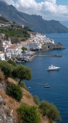 Obraz premium The scene shows a stone bridge leading to a cliffside town. Clear blue water and colorful buildings fill the view on a sunny day