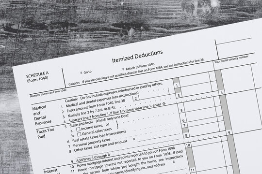Itemized deductions tax form financial paperwork concept
