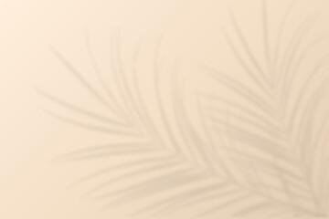 Obraz premium Blurred beautiful foliage tropical palm leaves shadow on beige wall background, Natural coconut leaf shadow overlay on sand color as summer backdrop, beauty, cosmetic, skincare, product presentation
