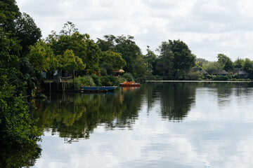 Obraz premium Soustons lake in Azur France showing tranquil water and moored boats