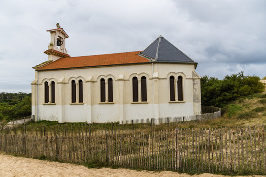 Chapel of Sainte-Therese in Labenne, France, under a cloudy sky.