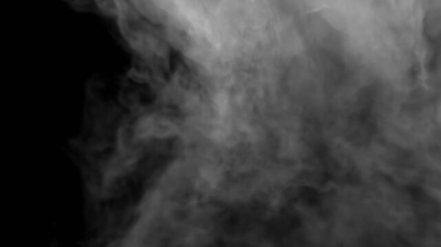 Smoke swirls in the light on the ground. Can be used as a special effect for your projects, video texture or background for designs, scenes, etc.