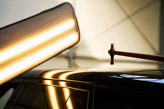 Paintless dent removal requires dynamic metal massaging using targeted knockdown strikes.