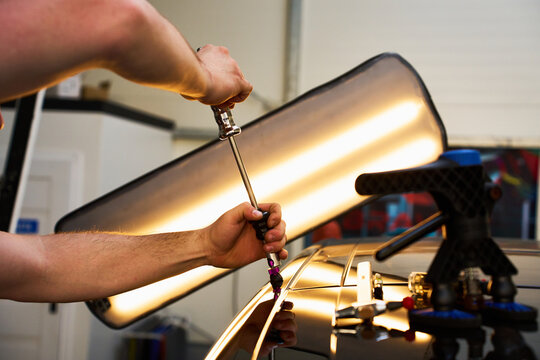 Close-up PDR Cold Glue Application.