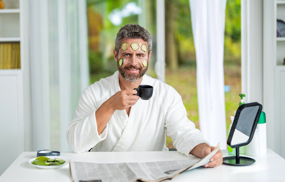 Hispanic man with facial cucumber mask. Benefits of vitamin C. Man applying facial mask with cucumber. Facial mask of cucumber. Cosmetic procedure man with cucumber slices mask on face. Skin refresh