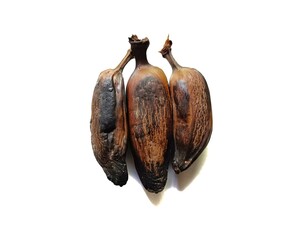 Three ripe roasted plantains musa x paradisiaca sweet cooked bananas isolated on white background © ByronObed