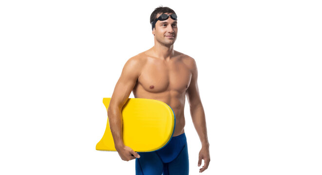 Man in blue swim trunks holding yellow kickboard and goggles