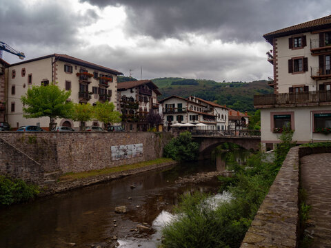 Elizondo town buildings along baztan river on a cloudy day
