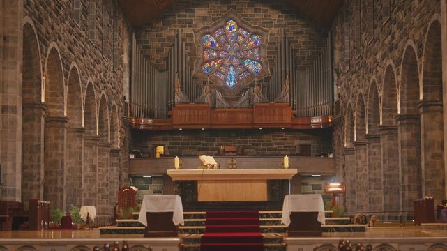 Church Altar with Stained Glass Window Interior in Ireland