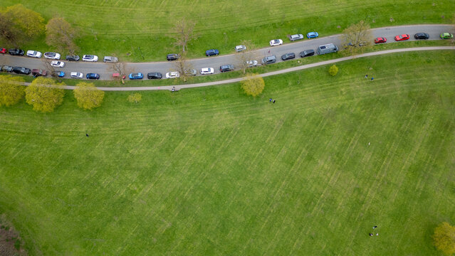 Aerial View of Park with Line of Cars in Harrogate, UK.