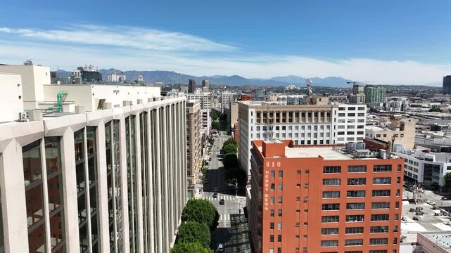 Los Angeles, California, USA - Aerial Drone View of Downtown LA Fashion District Between Residential and Commercial Buildings with Busy City Streets and Urban Traffic