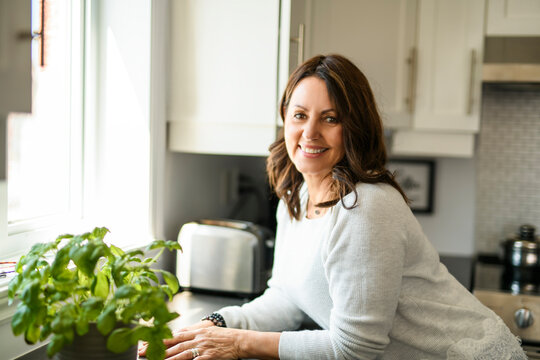 Senior woman, having great time on kitchen