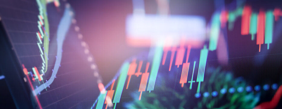 Abstract macro shot of financial stock market charts on a computer screen. Neon glowing trading and cryptocurrency indicators with visible pixel grid.