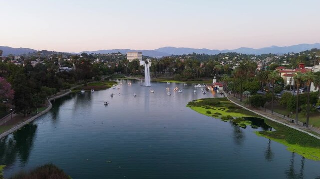 Aerial view of Echo Park Lake with fountain and paddle boats at sunset in Los Angeles