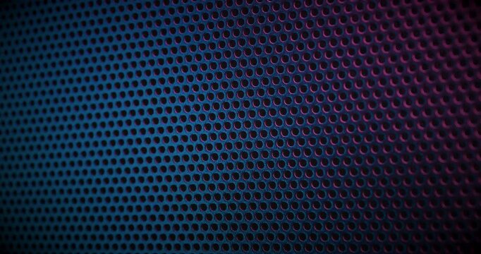 Close-up view of a color perforated surface with a repeating hole pattern, creating a textured and industrial look.
