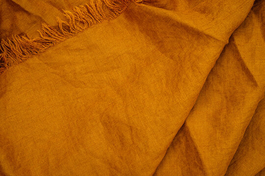 Soft fabric in warm tones displayed on a flat surface for textile art or sewing project