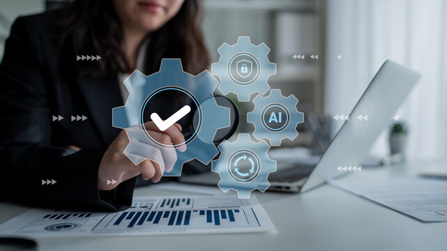 A business professional engages with digital icons representing technology processes in a sleek workspace, emphasizing data analysis and system interactions. Gantry