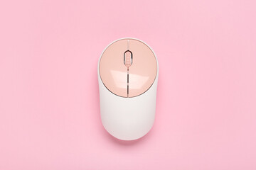 Modern wireless computer mouse on pink background