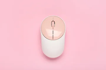 Modern wireless computer mouse on pink background © Pixel-Shot
