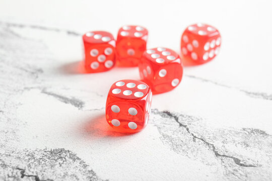 Red dices on light background