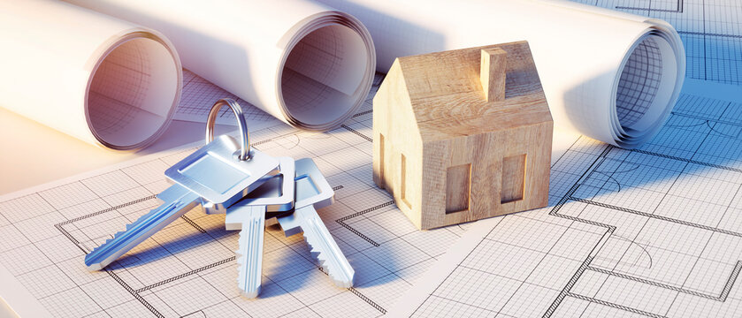 Keychain and keys with symbol house and architectural plans - concept of planning a home
